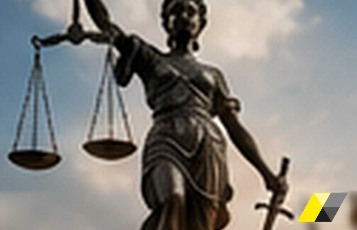 Bronze statue of Justice holding the scales against the sky: the defence of the company in Decree 231 proceedings